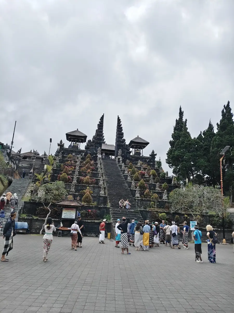 Visitors wearing sarongs below the main temple stairs at Besakih