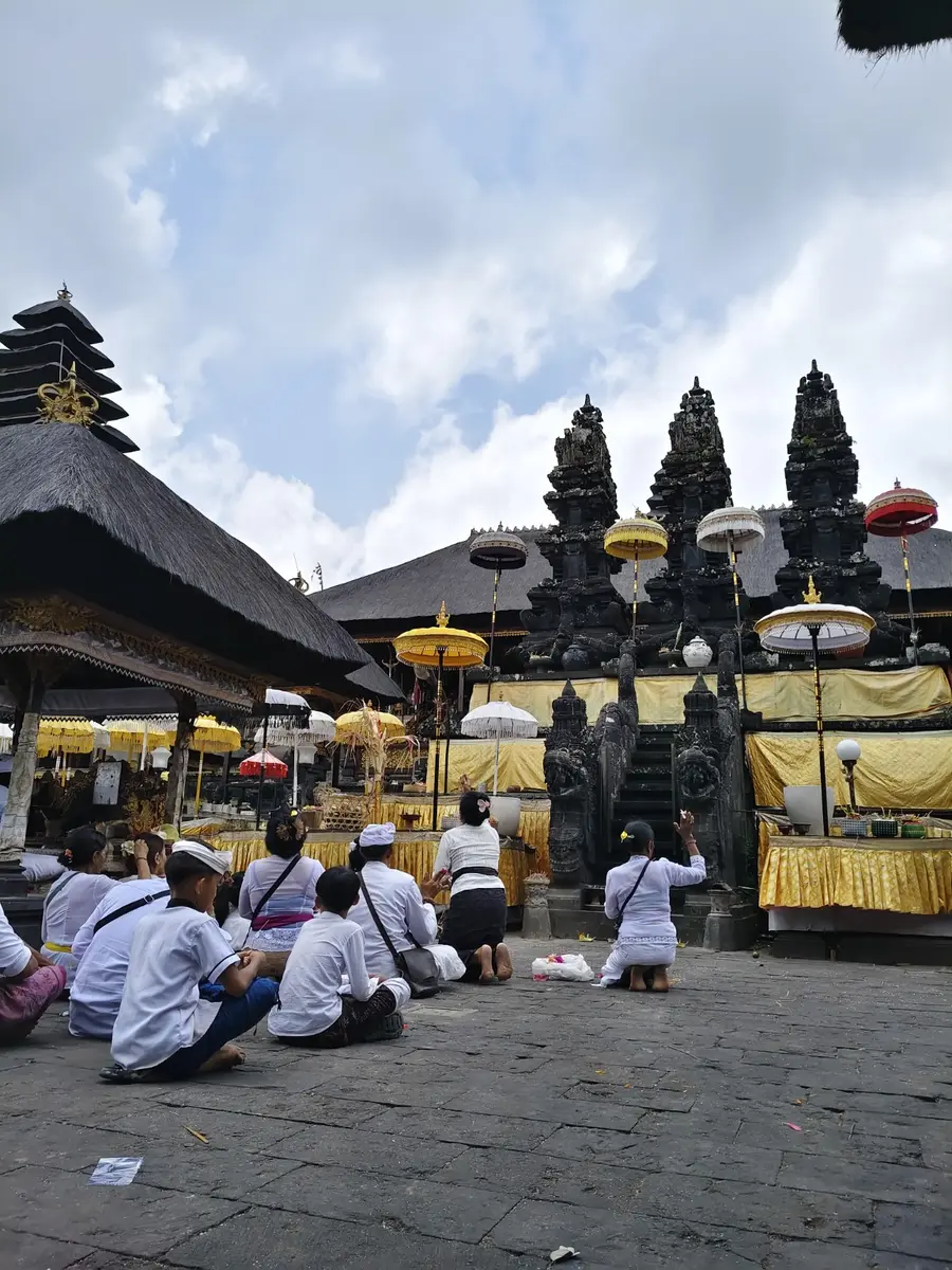 Balinese Hindu worshippers praying inside Besakih Temple
