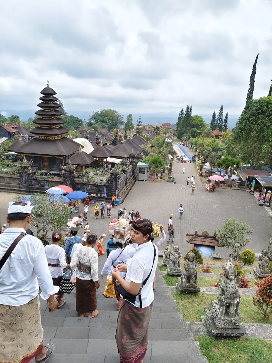 Temple visitors descending the stone staircase at Besakih
